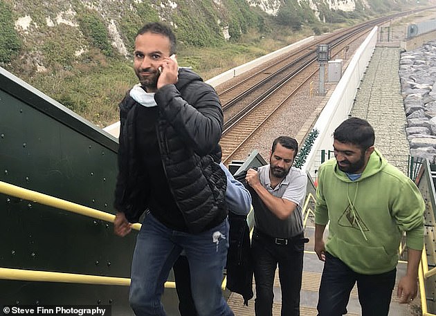 Favourable weather in the English Channel has made the crossing possible for hundreds of migrants over the last 10 days. Pictured: A group in Dover on Friday