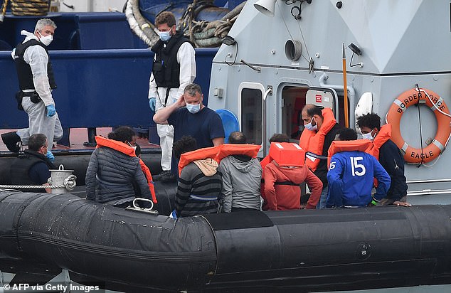 More than 900 migrants (some pictured today) have arrived in Dover this month as calmer waters over the Channel present an opportunity for crossings in small boats