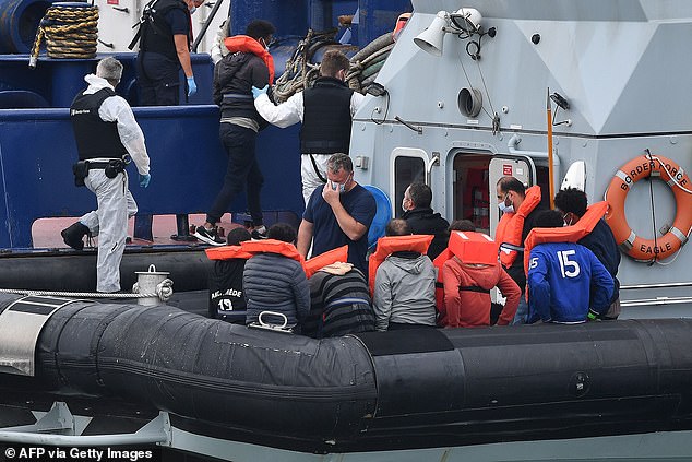 Around 16 migrants (some pictured) arrived in Dover today after making the treacherous journey across the English Channel this morning.