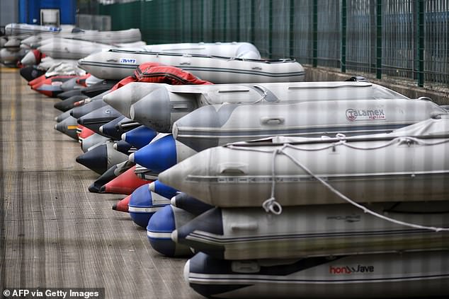 More than 1,000 migrants arrived in the UK in 10 days after crossing the Channel in small boats. Pictured: Dinghies believed to have been used by migrants are stored in Dover