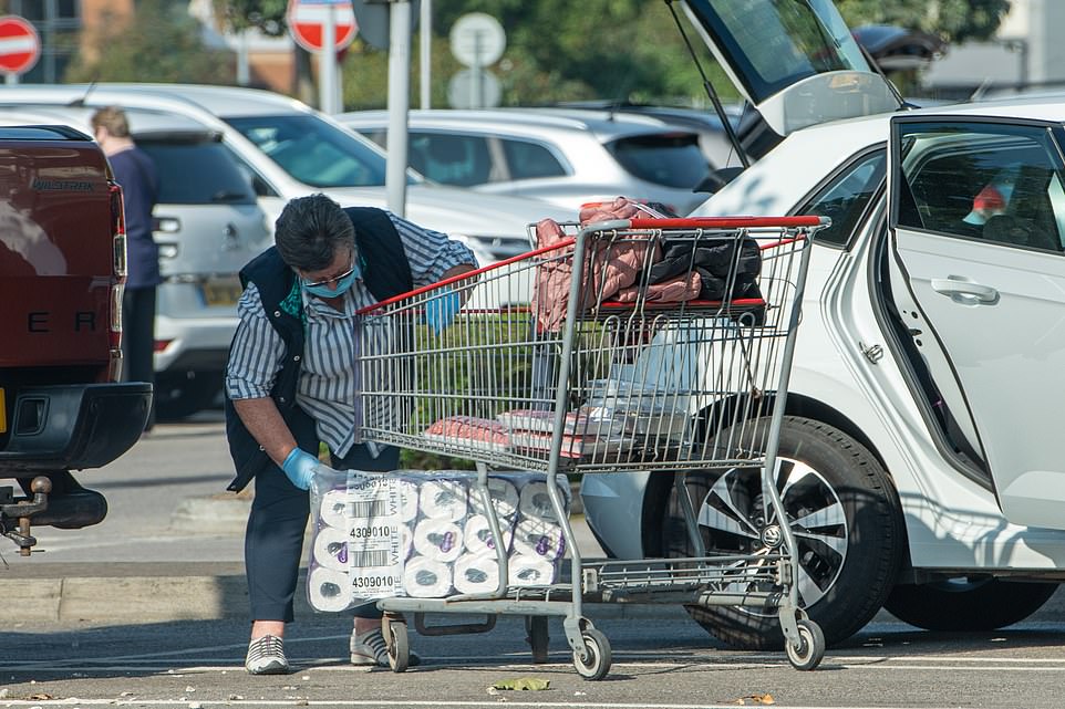 Panicked shoppers are emptying the shelves of toilet roll amid fears a second coronavirus lockdown could be announced (pictured, shoppers at Costco in Leeds)