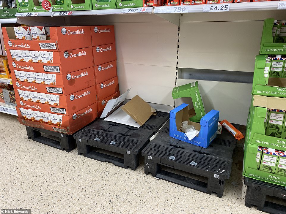 Long-life milk appears to be running low at a Tesco in South London as scores of customers rush to their nearest shops to stock up